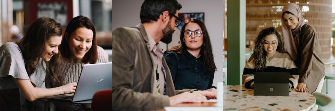 Group of people working together behind computer